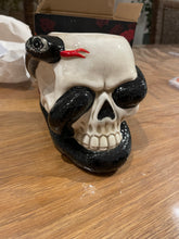 Brûleur crâne et serpent